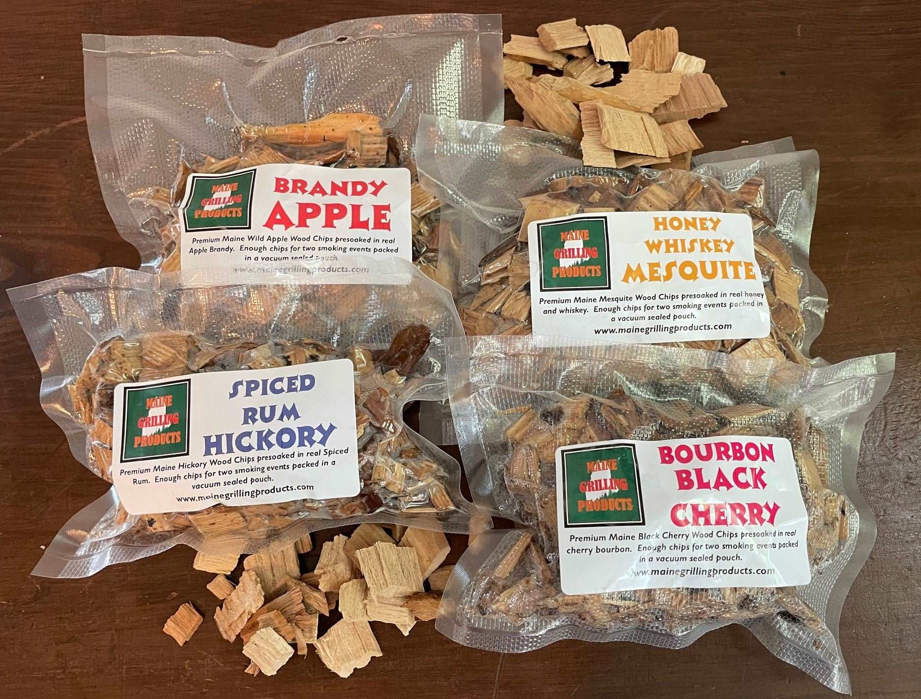 PRE-SOAKED MAINE WOOD CHIPS VARIETY PACK (ONE EACH 6 OZ POUCH) BRANDY APPLE, HONEY WHISKEY MESQUITE, SPICED RUM HICKORY, AND BOURBON BLACK CHERRY